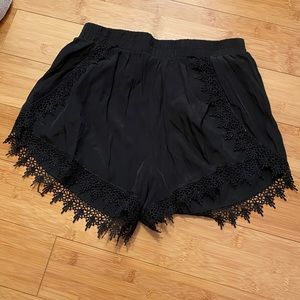 black flowy shorts with lace trim
